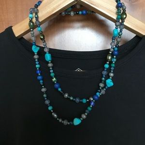 Long beaded strand necklace with blue tones